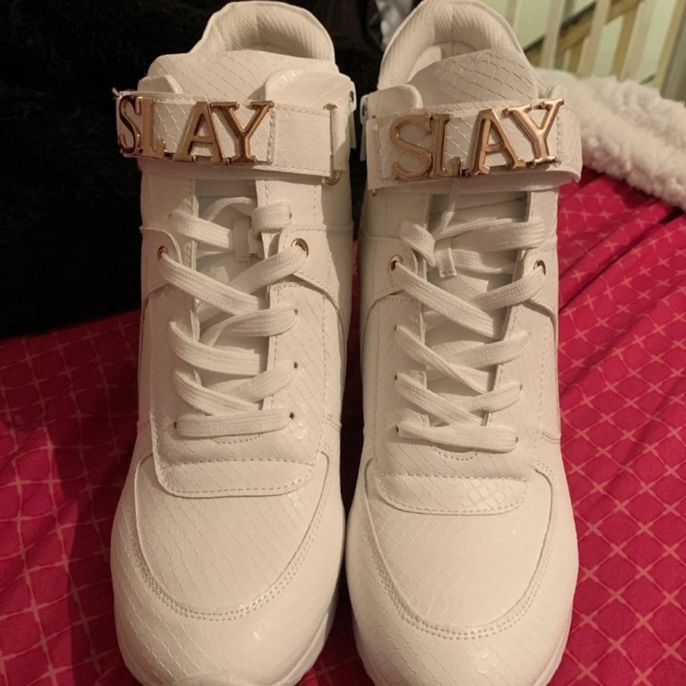White sneaker wedges and slay written across